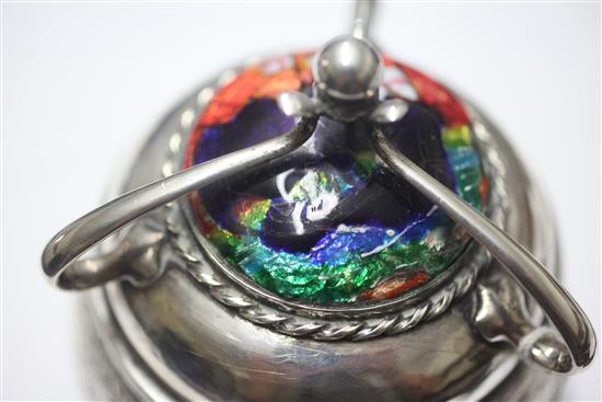 An Edwardian Arts & Crafts planished silver and enamel circular box and cover by Ramsden and Carr, height 11.5cm.